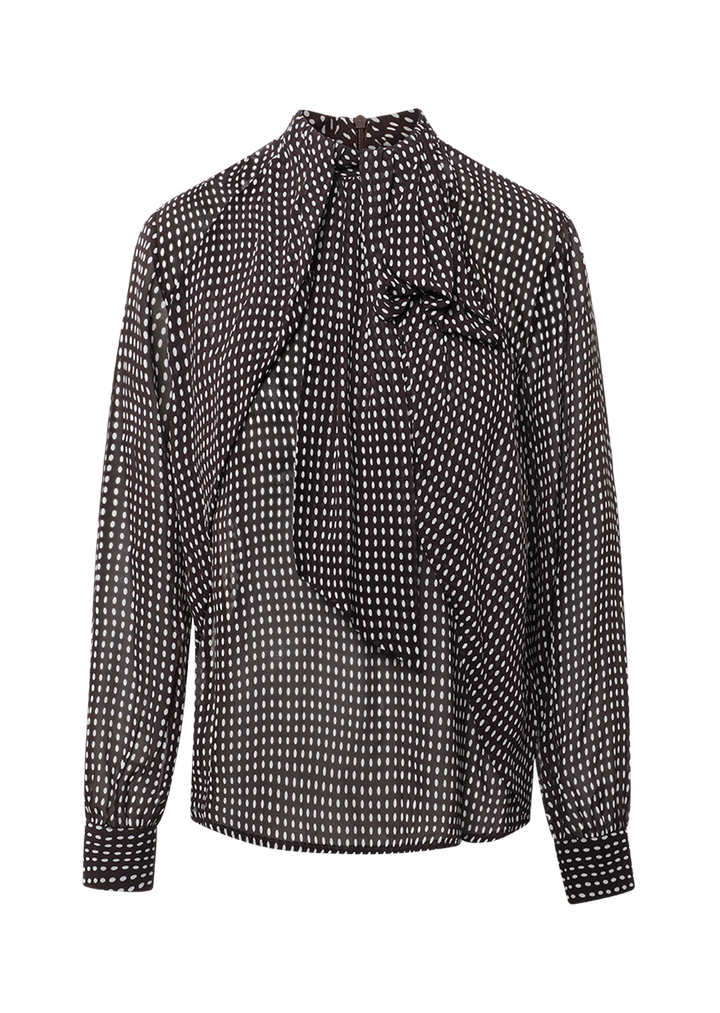 Braune Bluse Dorothea von 0039 Italy mit weißem Punktemuster, angenähter Schluppe und leicht transparenten Ärmeln.