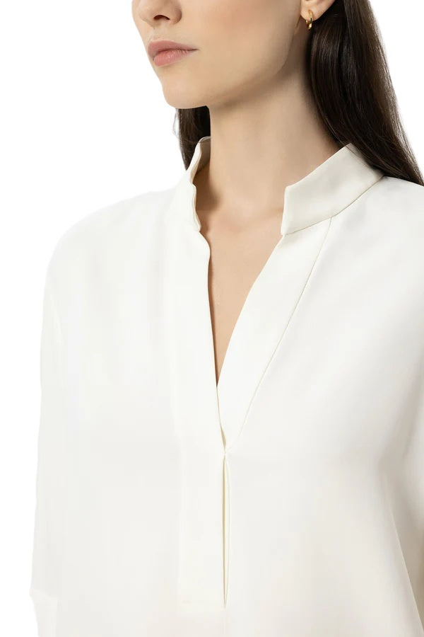 Bluse Luisa Cerano in Tunikaform in cremeweiß. Die Bluse besteht aus elastischer Viscose und ist gerade geschnitten mit 3/4 Aermeln. 