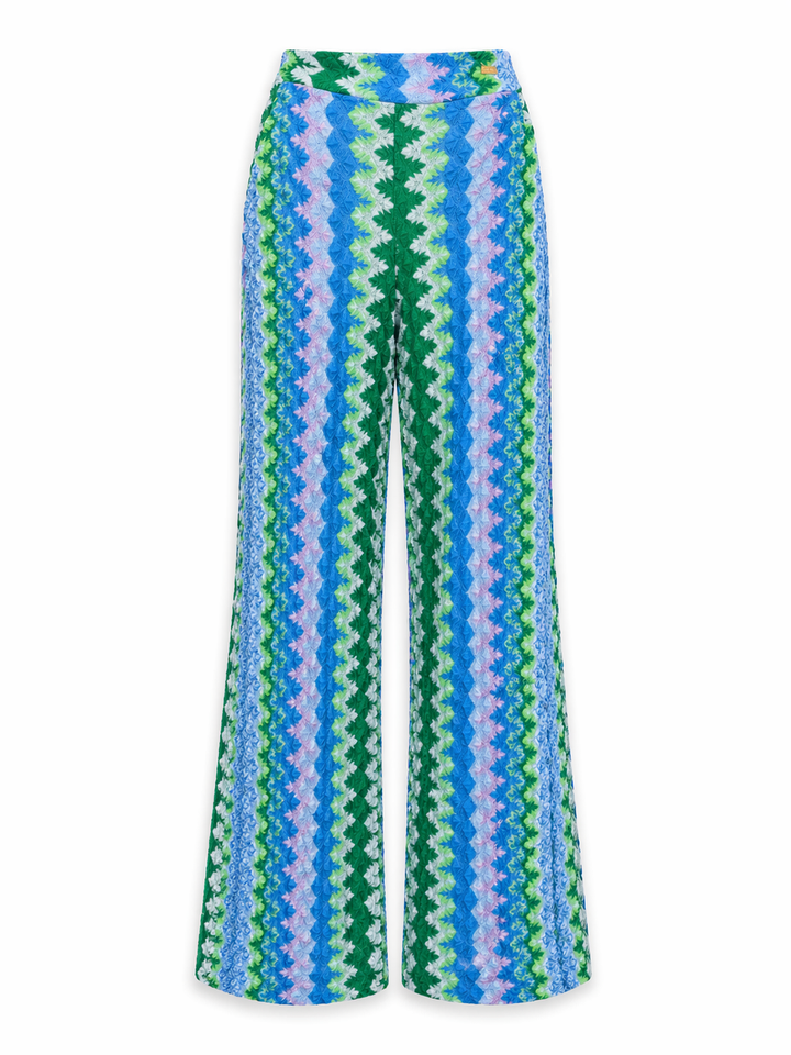 Hose Pho Firenze in blau und grün. Schöne sommerliche Hose im berühmten Zickzack-Muster. Die Hose ist gerade geschnitten und hat einen Gummibund und Taschen. Die Beinlänge ist lang und ganz leicht ausgestellt.