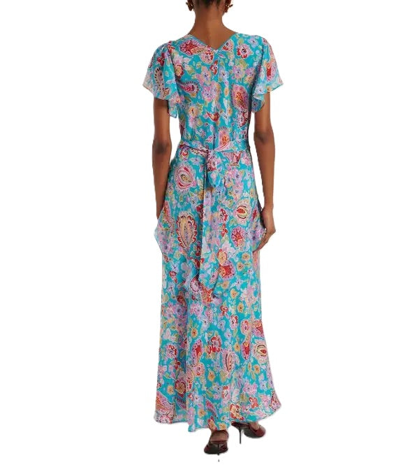 Kleid Rixo Evie Dress in  Cara Floral Turquois. Ganz besonderes Kleid mit wunderschönem Blumenmuster. Das Kleid ist aus Seide und fällt wunderschön auf der Haut. Es hat einen V-Ausschnitt und kleine Flügelärmel. An der Taille ist es schmal geschnitten. Das Kleid hat einen Gürtel, den man hinten oder vorne binden kann.