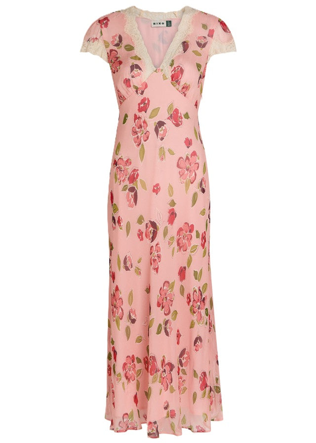 Kleid Rixo. Wunderschönes Kleid mit Blumenprint. Am Ausschnitt und am Ärmel ist das Kleid mit Spitze verziert. Am V-Ausschnitt wurde noch eine hübsche zarte Rose plaziert. Das Kleid hat einen kleinen Gürtel und ist lang geschnitten.
