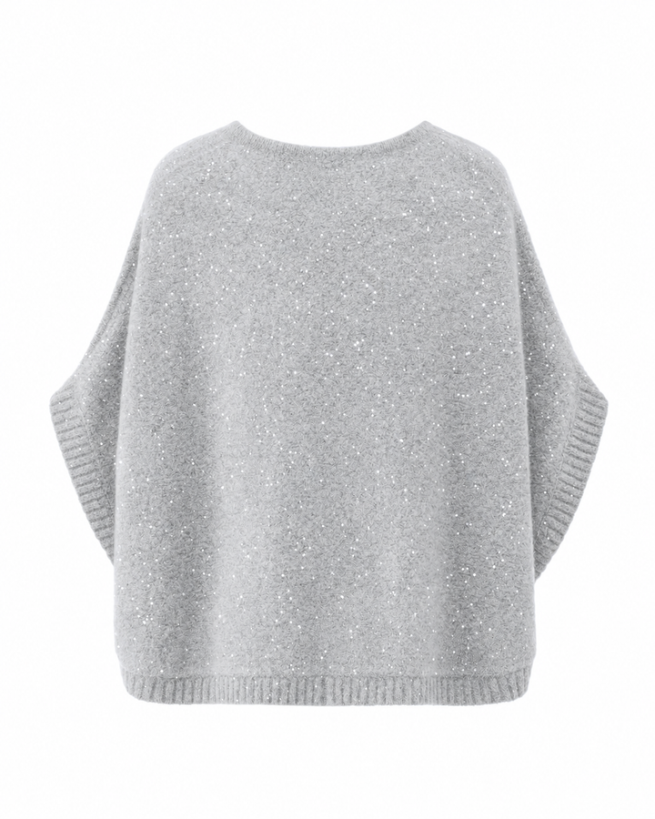 Grauer Poncho TRISHA von Luren mit eingearbeiteten Glitzerpailletten, Oversize-Silhouette und Rundhalsausschnitt. Aus Kaschmir-Seide Strick.