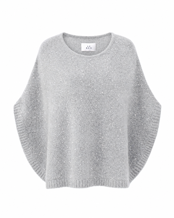 Grauer Poncho TRISHA von Luren mit eingearbeiteten Glitzerpailletten, Oversize-Silhouette und Rundhalsausschnitt. Aus Kaschmir-Seide Strick.