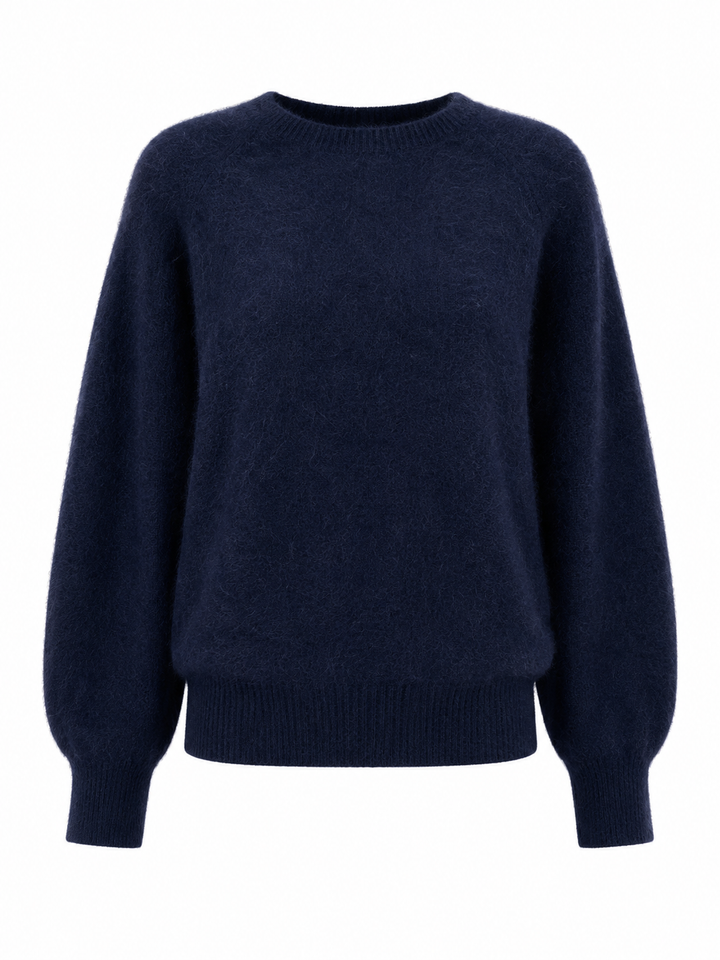 Der Kaschmir-Wolle Pullover von der Marke Herzens hat lange Ballonärmel. Er hat einen Rundhalsausschnitt und ist in der Farbe Dunkelblau.