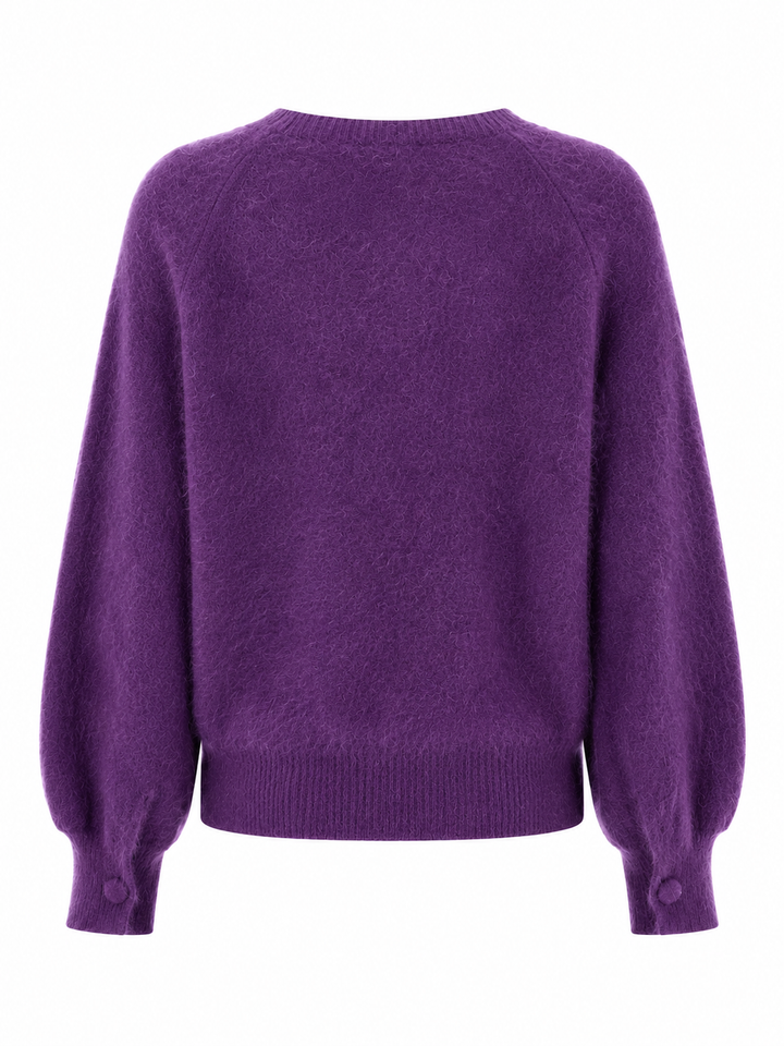 Der Kaschmir-Wolle Pullover von der Marke Herzens hat lange Ballonärmel. Er hat einen Rundhalsausschnitt und ist in der Farbe Lila.