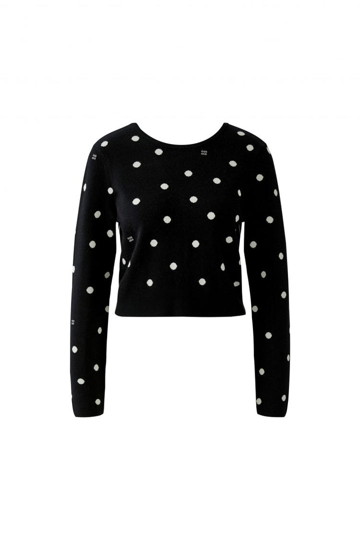 Wendbarer Pullover von Oui in schwarz mit weißen Punkten. Den Pullover kann man von zwei Seiten tragen. Auf der Rückseite befindet sich eine Knopfleiste. 