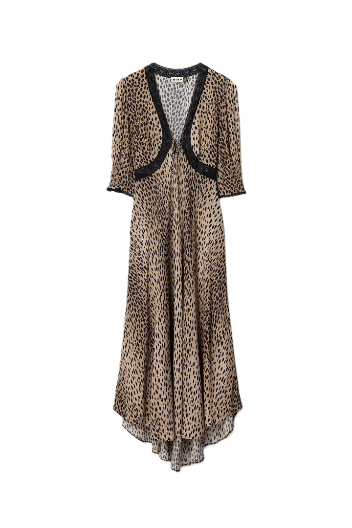 Kleid Rixo Amina Dress Antelope Spot Black. Super schönes Kleid aus einer leichten Ware. Das Kleid hat einen halben Ärmel mit Gummizug und einen Spitzenbesatz am V-Ausschnitt. Das Kleid hat einen tiefen Ausschnitt und ist mittellang. Der Ausschnitt ist noch mit einem Bändchen variabel zu verstellen. Das Kleid hat eine erhöhte Taille und einen Zipverschluss.